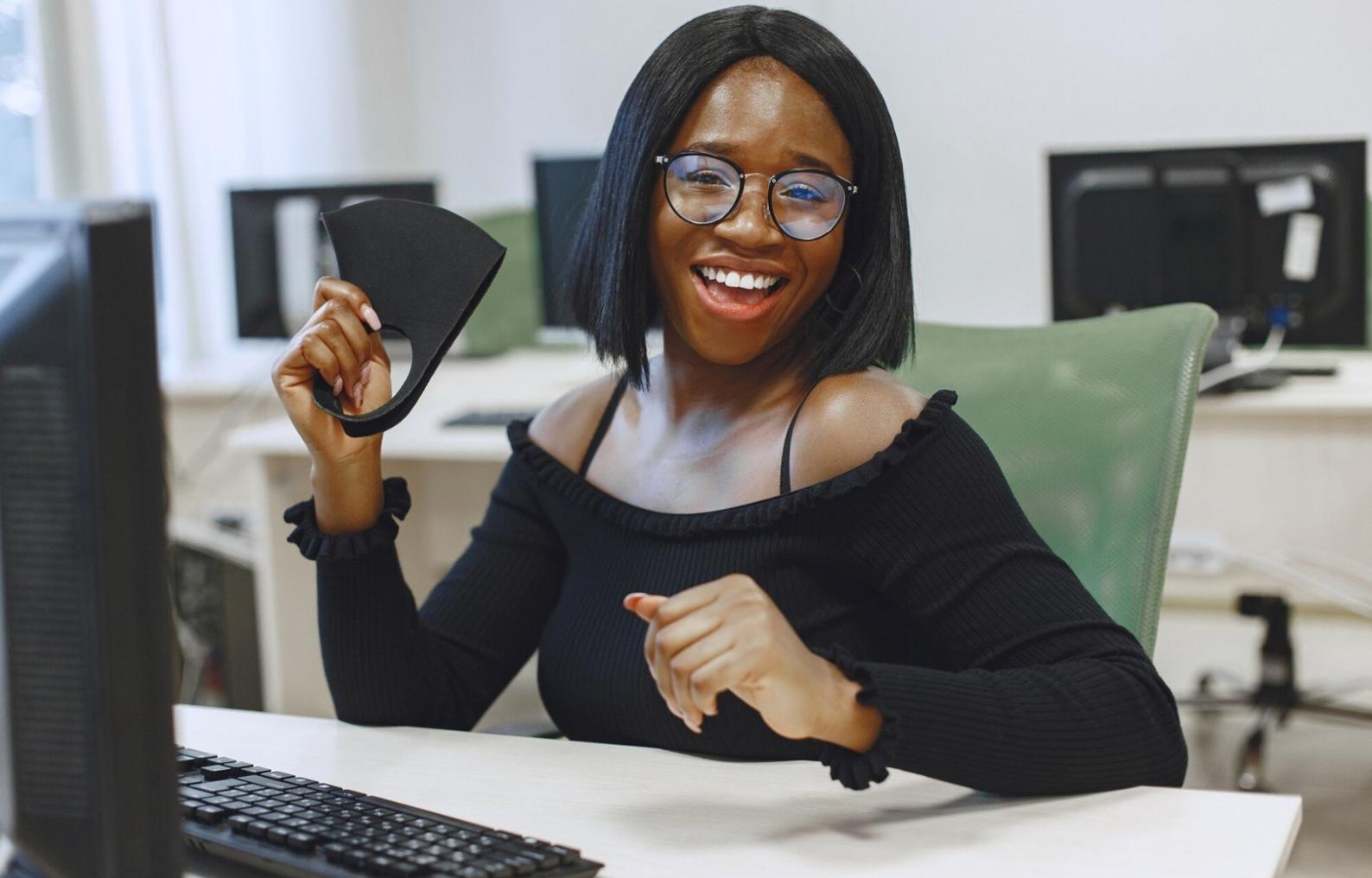 Typography researcher conducting usability tests with participants reading content on various devices
